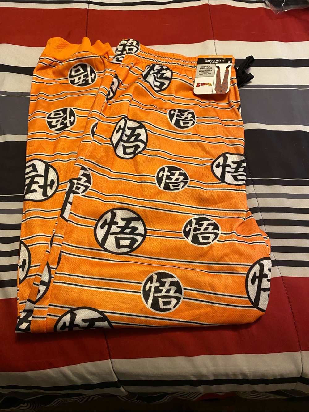 E) Orange Graphic Lounge Pants with Black and White Symbols. Sz Lg